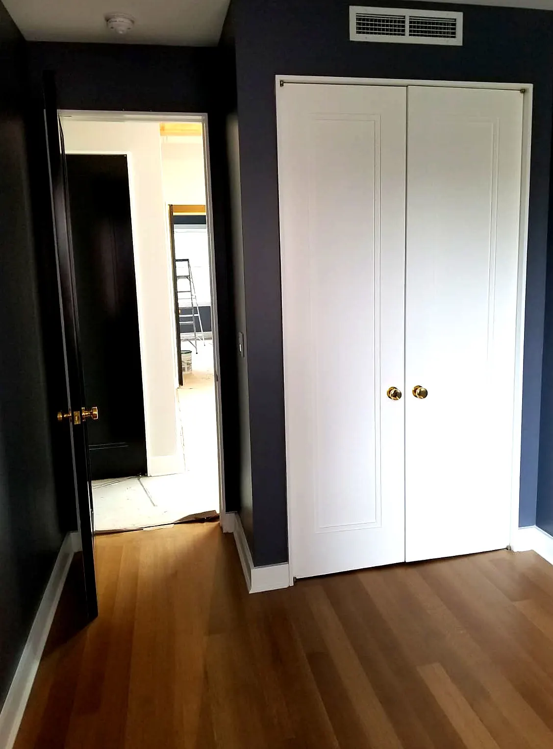 Bedroom · Navy Walls & White Millwork
