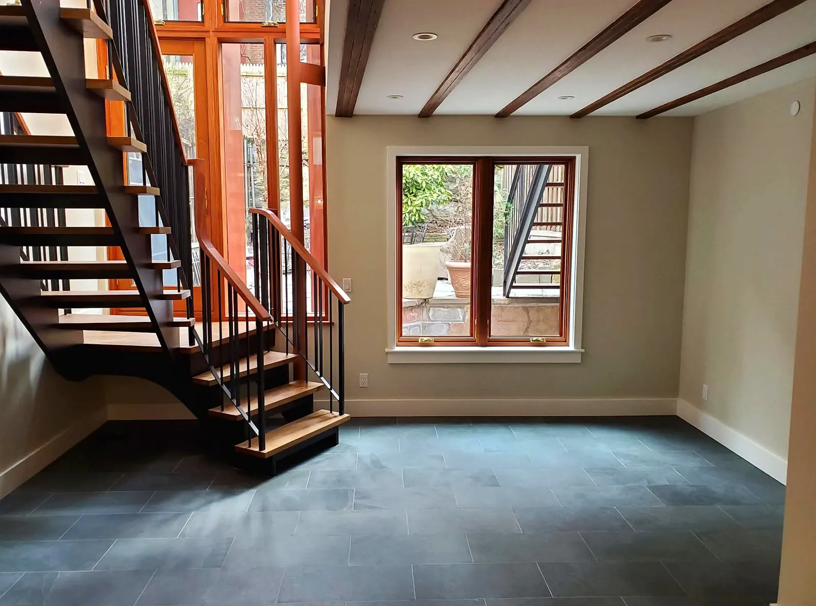 Brownstone Basement · Slate Tile & Exposed Beams