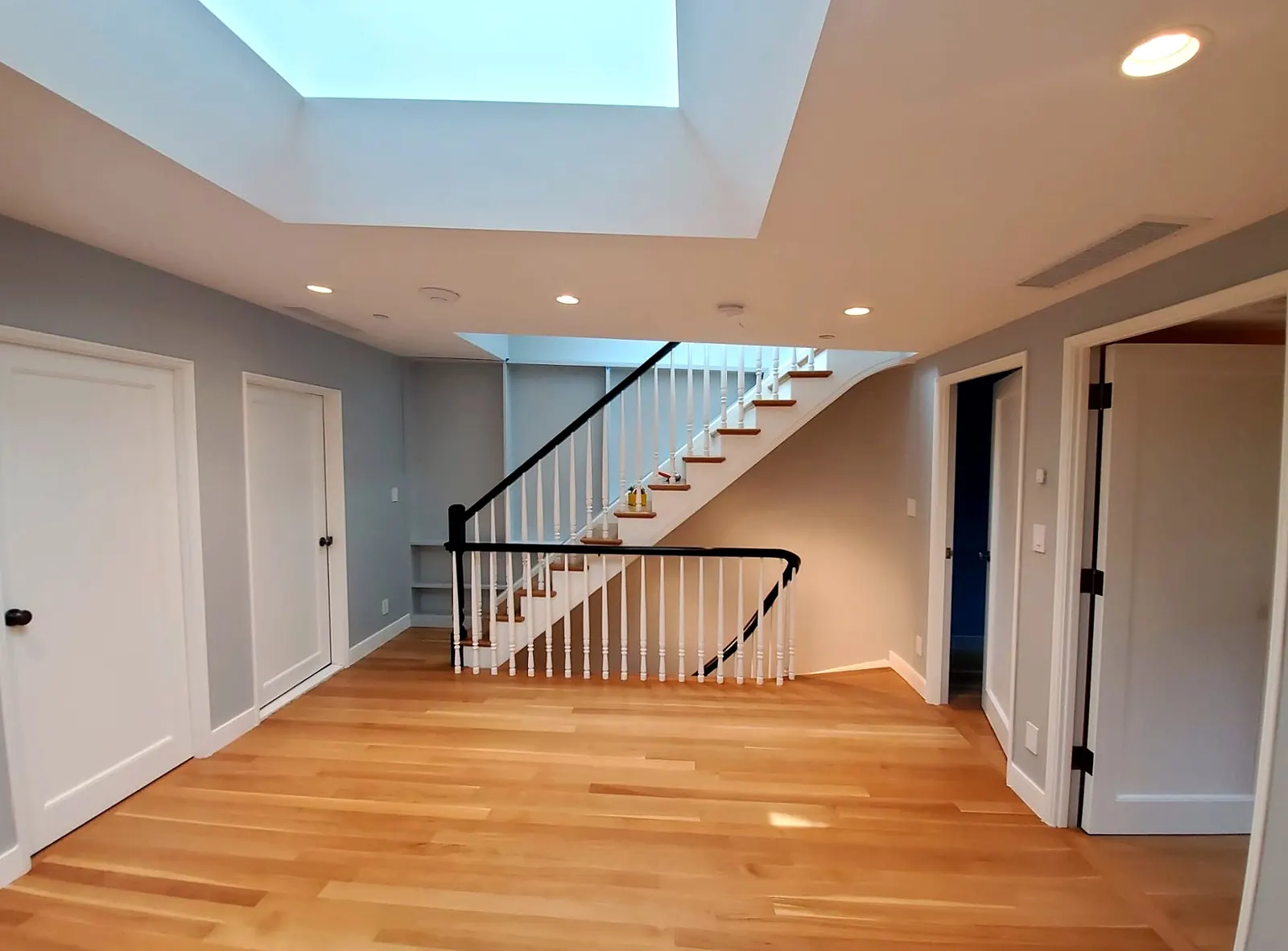 Living Space Renovation · Hardwood Floors & Skylight